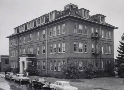 1952 photograph of Forestry Building (Morrill Hall). Automobiles in foreground.