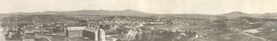 1916 panoramic photograph of University of Idaho campus. View of Moscow Mountain in the background.
