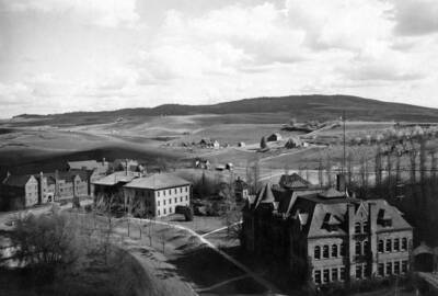 1926 panoramic photograph of University of Idaho campus. Southeast corner of campus with farms in the background. Donor: Biological Sciences Dept.