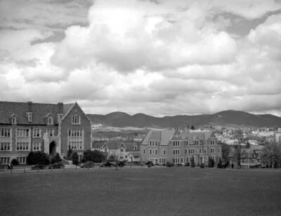 1936 panoramic photograph of University of Idaho campus. Automobiles parked in front of the Administration building.