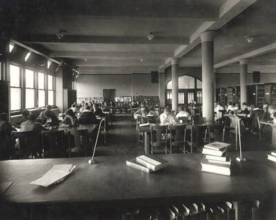 1917 photograph of the Library. Students studying in the background.
