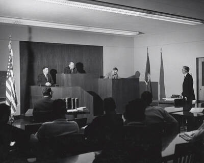 1952 photograph of the College of Law. Students participate in a mock trial.