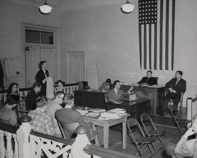 1952 photograph of the College of Law. Students participate in a mock trial. Donor: Publications Dept.