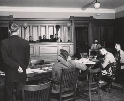 1952 photograph of the College of Law. Students participate in a mock trial. Donor: Publications Dept.