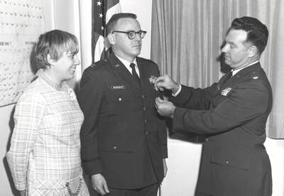 1960 photograph of Air Force Officer Education Program. A medal pinning ceremony.