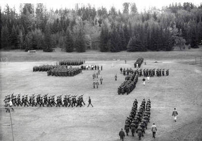 1962 photograph of Military Science Cadets. Military cadets participating in a drill period. Donor: Army ROTC.