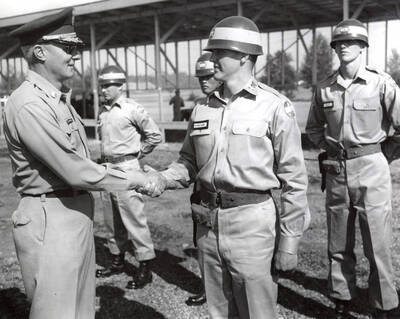 1959 photograph of Military Science Cadets. Cadets at summer camp, Fort Lewis. Donor: Army ROTC.