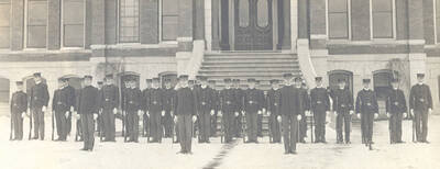 1905 photograph of Military Science Cadets. Cadet company 'A' in formation in front of old Administration building steps.