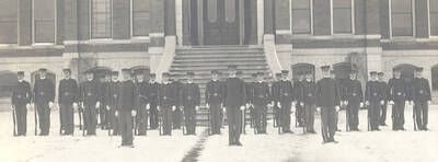 1905 photograph of Military Science Cadets. Cadet company 'B' in formation in front of old Administration building steps.