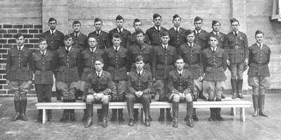 1932 photograph of Military Science Cadets. Junior officers standing against a wall. Donor: Gerald Hodgins.