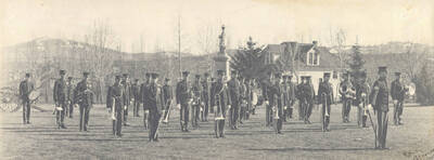 1909 photograph of Military Science Cadets. Military band in formation in front of the Spanish-American War Memorial.