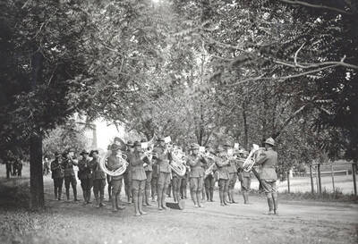 1923 photograph of Military Science Cadets. Military band in formation.
