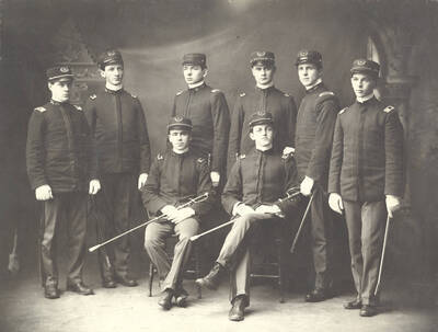 1903 photograph of Military Science Cadets. Portrait of cadet officers. l-r: (front) John Auld, Robert Ghormley, (Back) Howard Kirkwood, Earl David, Clarence Edgett, Lloyd Gibson, Earl Barton, Leroy Zeigler.