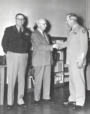 1951 photograph of Military Science Cadets. The inspection team being greeted l-r: C.F. Hudson, T.S. Kerr, C.H. Bragg..