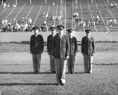 1953 photograph of Military Science Cadets. Regimental staff l-r: Wayne D. Anderson, J.H. Bengston, Peter F. Stickney, F.L. Kopke, Phillip R. Ourada.