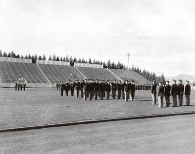 1953 photograph of Military Science Cadets. Military cadets on parade at MacLean field.