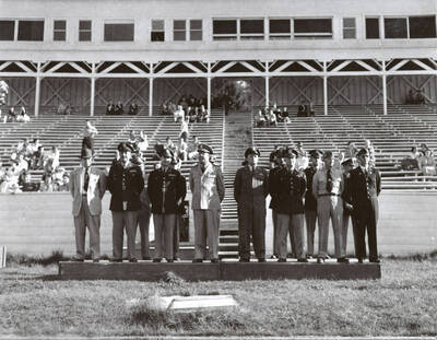 1953 photograph of Military Science Cadets. Officers reviewing cadets at MacLean field.