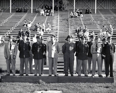 1953 photograph of Military Science Cadets. Officers reviewing cadets at MacLean field.