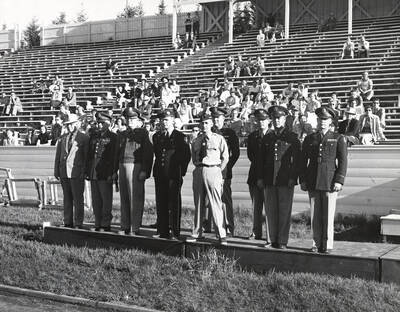 1952 photograph of Military Science Cadets. l-r: T.S. Kerr, T.M. Brinkley, C.F. Hudson, Clyde Smith, Stowell Johnstone, Jack Parsons, A.E. Blewett.Also print. Officers reviewing cadets at MacLean field.