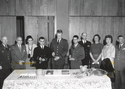 1962 photograph of Military Science Cadets. l-r: Col. James, Pres. Theophilus, Mrs. Theophilus, Lillico, King, Candray, Capt. Davey, Mrs. Davey, Mrs. Pattison, Col. Pattison.