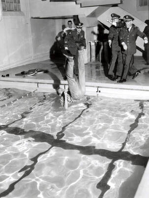 1962 photograph of Military Science Cadets. l-r: Cadet Hentigg, Maj. Wm. R. Cashman, Cadet Charles William lange Jr. (in flight), Lt. Col. Gregg d. Breitegan, Col. George W. James. Donor: Army ROTC.