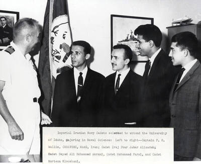 1965 photograph of Naval Science. Imperial Iranian Navy candidates selected to attend the Naval Science program. l-r: Captain F.H. Wallis, I.P.J. Alizadeh, S.A.M. Akrami, M. Farsi, M. Klooshani.. Donor: Publications Dept..