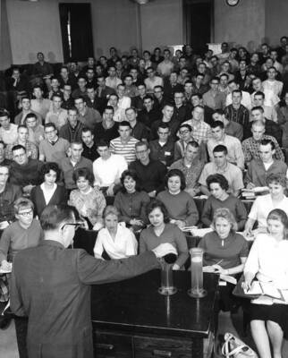 1960 photograph of Chemistry Class. Dr. Jolley lectures students during class.