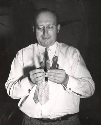 1960 photograph of Zoology building. View of professor and specimens.