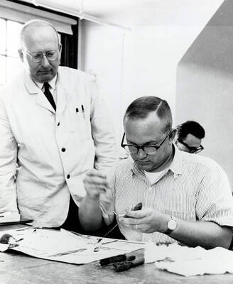 1966 photograph of Zoology building. Students learns the how to preserve animal skins.