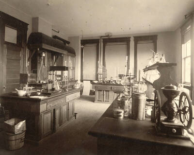 1906 photograph of Agricultural chemistry building. View of the lab workstations.
