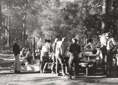 1952 photograph of College of Forestry. Students lined up at the chow line during the Forestry summer camp.