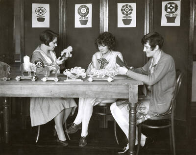 1926 photograph of Home Economics. Students making toys.