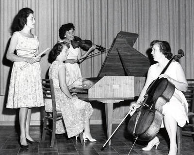 1960 photograph of Music Department. Baroque Quartet Dvora Marcuse, Marian Frykman, Eleanor Mader, and Phyllis Everest.