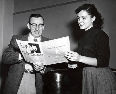 1952 photograph of Music Department. Glen Lockery and Marigay Nelson, student conductor for University of Idaho Vandaleers.