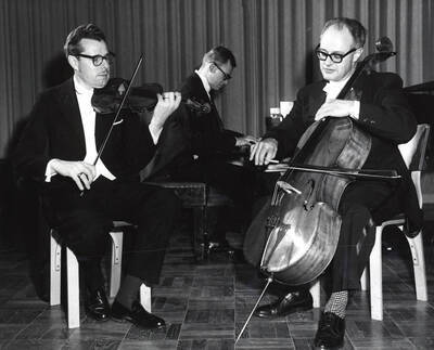 1961 photograph of Music Department. Music Faculty Trio LeRoy Bauer, David Tyler, and David Whisner performing. Donor: Publications Dept.