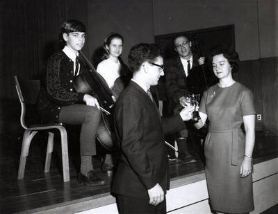 1966 photograph of Music Department. Charles Bauer, Shirley Cowen, Achilles Balabanis, Steven Bray, Lois Lyon. Donor: Publications Dept.