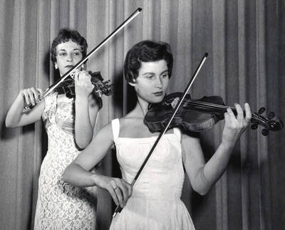 1952 photograph of Music Department. Violin Duo performing. Donor: Publications Dept.