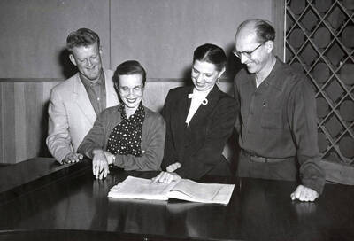 1956 photograph of Music Department. Vocal quartet Rex Eikum, Karen Hurdstrom, Eleanor Skok, and Norman Logan during the Inland Empire Music Festival. Donor: Publications Dept.