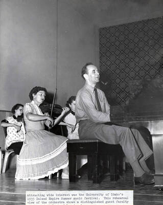 1955 photograph of Music Department. Orchestra rehearsing during the Inland Empire Summer Music Festival. Donor: Publications Dept.