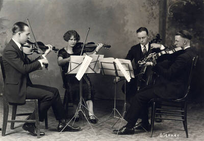 1926 photograph of Music Department. String quartet Carl Claus, Helen May Woods, Robert Reed, and Herman Steffens.