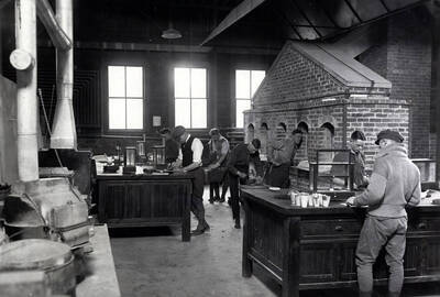 1923 photograph of College of Mines. Students in a laboratory during a class in fire assaying.