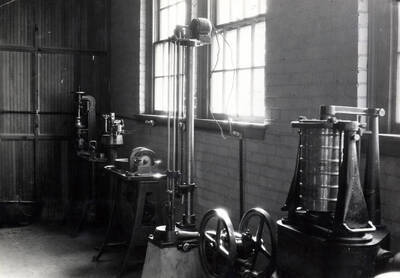1922 photograph of College of Engineering. Equipment in the highway laboratory.