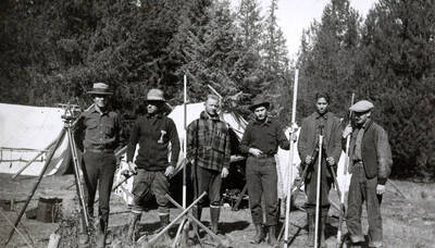 1922 photograph of College of Engineering. Students lined up in front of the field surveying camp.