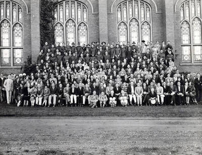 1928 photograph of College of Business Administration. Group photograph in front of the Memorial Gymnasium.