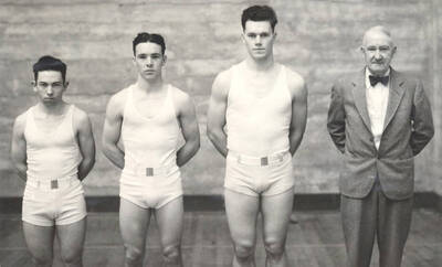 1933 photograph of Physical Education. Eric Newton Meneely, Henry Alfred Wilson, Benjamin Gene Wilcox, and Coach Ralph Fielding Hutchison.