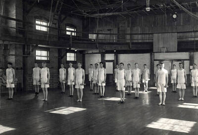 1911 photograph of Physical Education. Gymnastics class in women's gym.