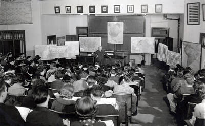 1940 photograph of European history class. Students attending a lecture hall in the Science Hall. Donor: Brosnan papers.