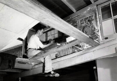 1936 photograph of Art and Architecture. Francis Newton frescoing a wall. Donor: Publications Dept.