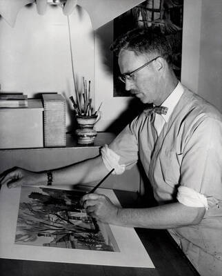1965 photograph of Art and Architecture. Alfred Dunn painting in a studio. Donor: Publications Dept.