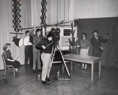 1960 photograph of Communications. Students recording during TV class.